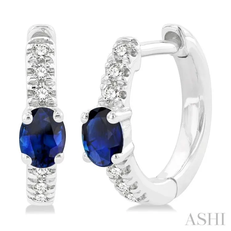 4X3 MM Oval Cut Sapphire and 1/10 ctw Petite Round Cut Diamond Fashion Huggies in 10K White Gold